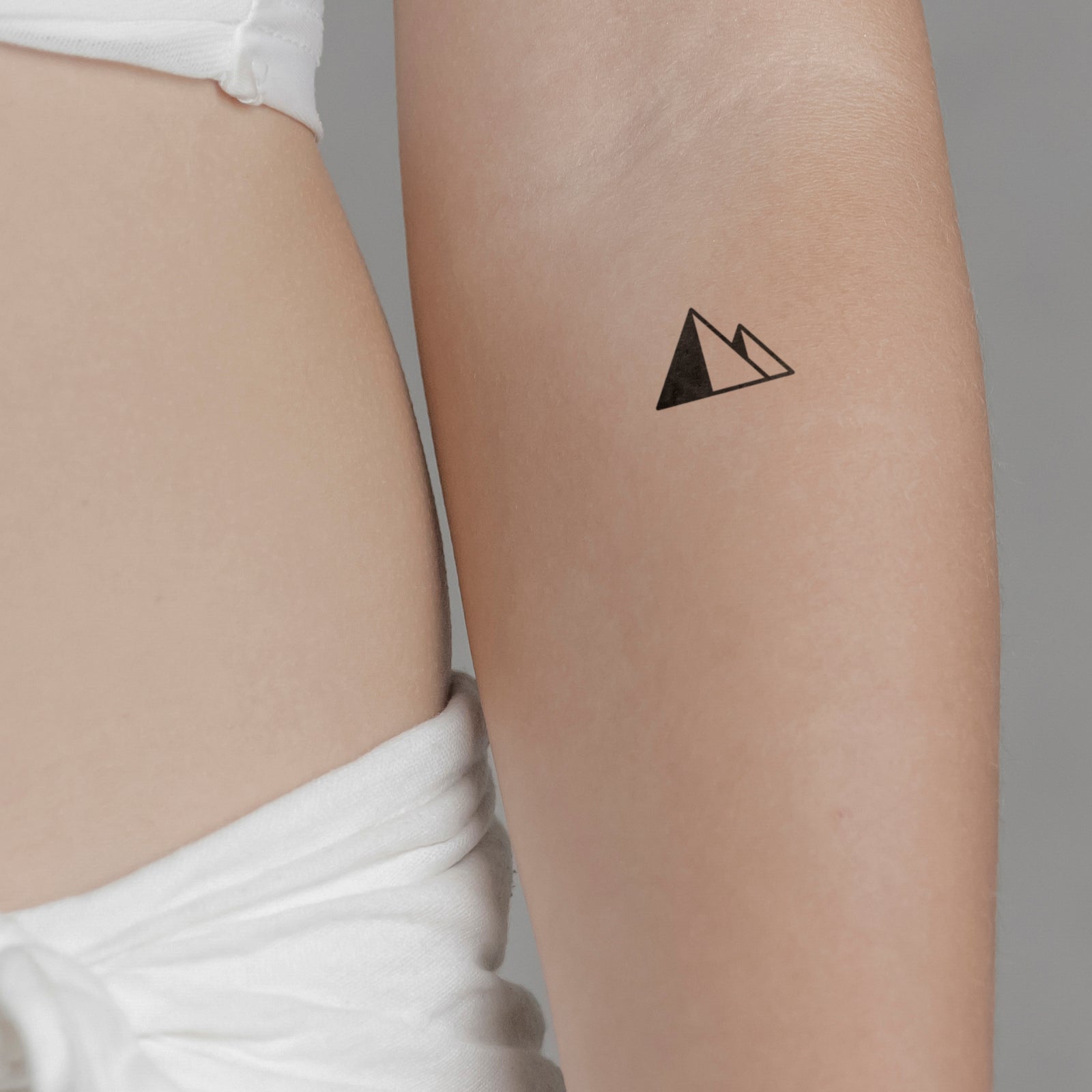 Simple mountain range | Small tattoos simple, Simple tattoos, Wrist tattoos  for women